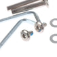 Close-up of metal luggage wheel mounting bracket and screws with washer pieces
