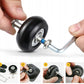 Hand installing a black luggage spinner wheel with metal axle and bearing components