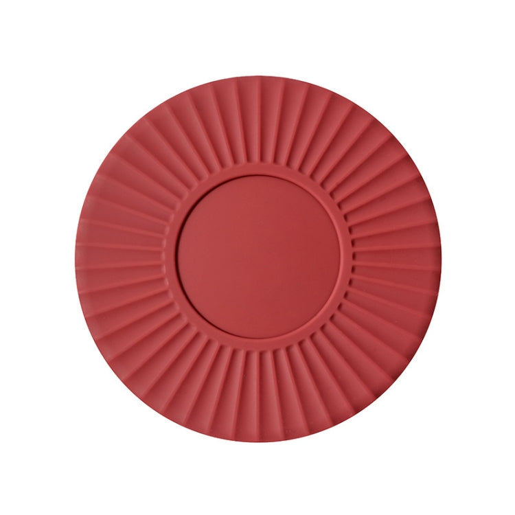 Red silicone heat insulation mat with fan-like ridges and a raised round center.