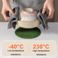 Green silicone heat insulation mat under a hot pot, with folded towels on top.