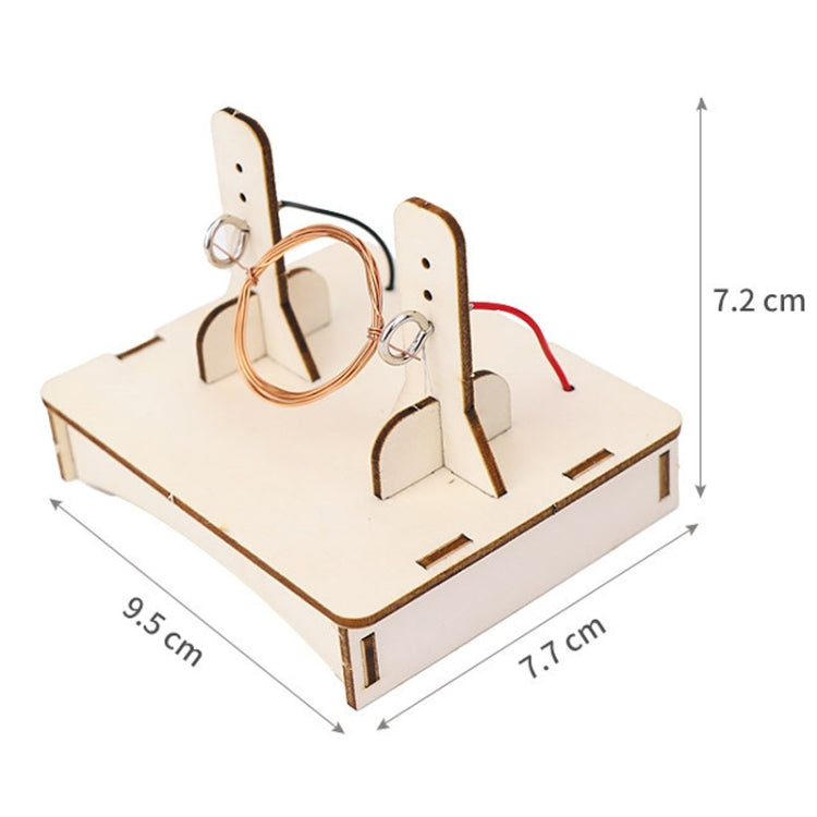 DIY DC motor kit wooden base with copper coil loops and two upright terminal supports