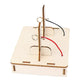 DIY DC motor kit wooden base with upright metal post and red/black wiring