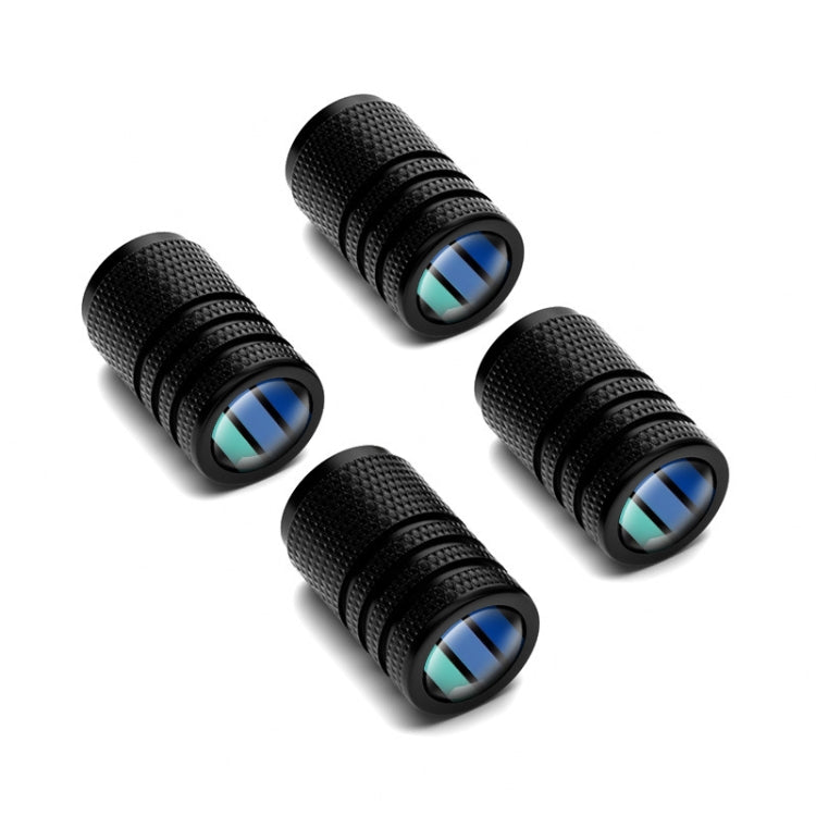 Four angled black textured valve caps with blue striped top inserts