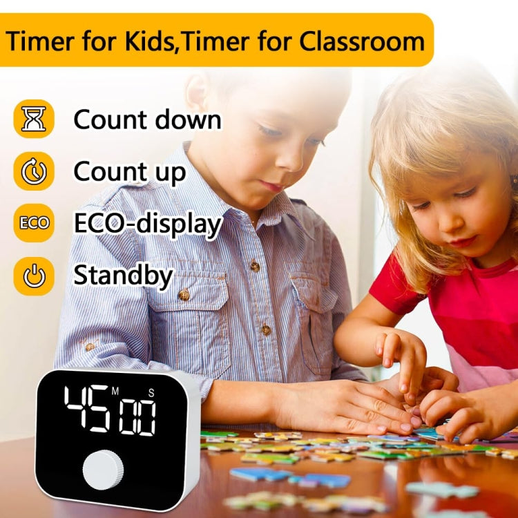 Digital kitchen timer on tabletop with LED countdown display and round dial