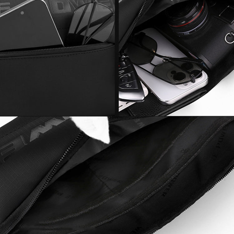 Black crossbody chest bag with open compartment holding small devices and accessories