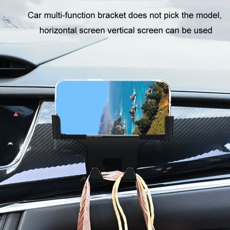 Car headrest phone holder with smartphone mounted on dashboard, dark screen