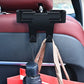Black headrest phone holder mounted on seat with hanging lanyards