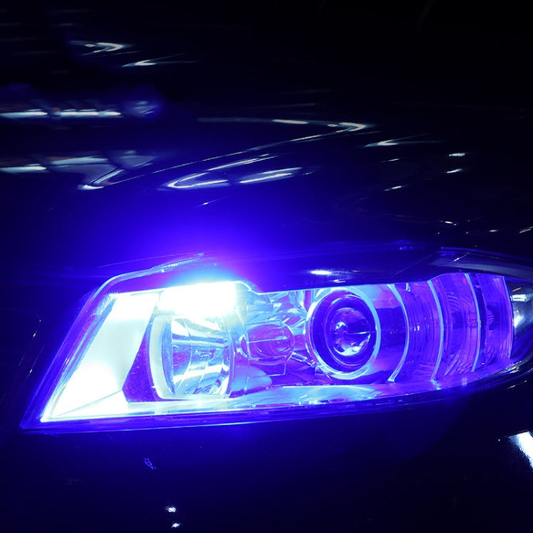 Blue LED headlight glow from a front lamp with bright projector-style lens