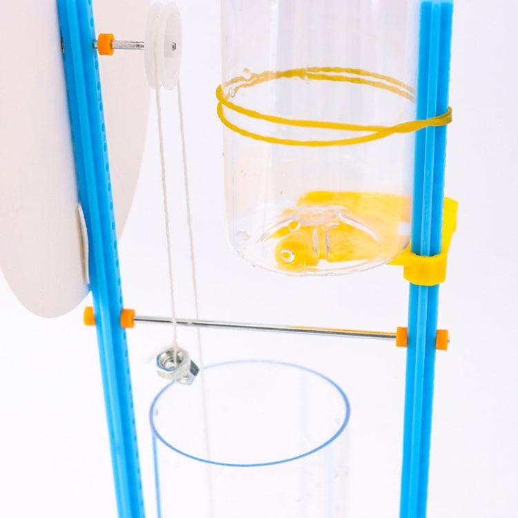 Close-up of clear water chamber and blue frame parts for a water-drop clock kit