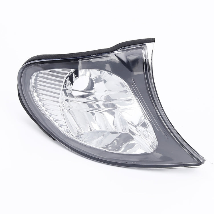 Front corner parking/turn signal light, clear white reflector lens with black housing