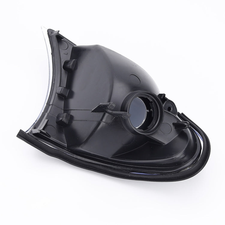 Front corner parking/turn signal light housing, black plastic rear view
