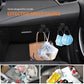Black car armrest storage hooks holding shopping bag and face mask bag