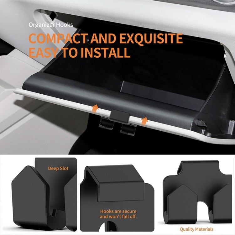 Black organizer hook pair that inserts into a car storage slot for secure fit