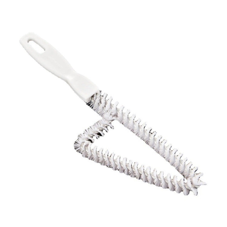 White crevice cleaning brush with flexible bristles and a hanging-hole handle