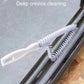 Crevice brush head scrubbing between window track gaps with dense white bristles