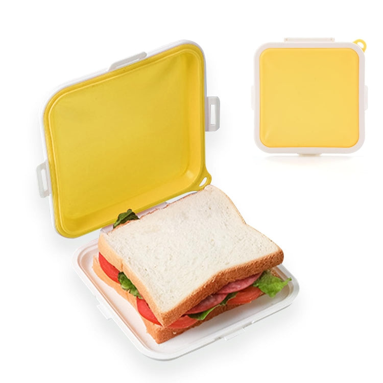 Yellow silicone sandwich bread storage box with open lid and sandwich inside