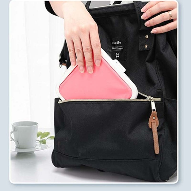 Pink silicone storage box inside a tote bag with lid closed