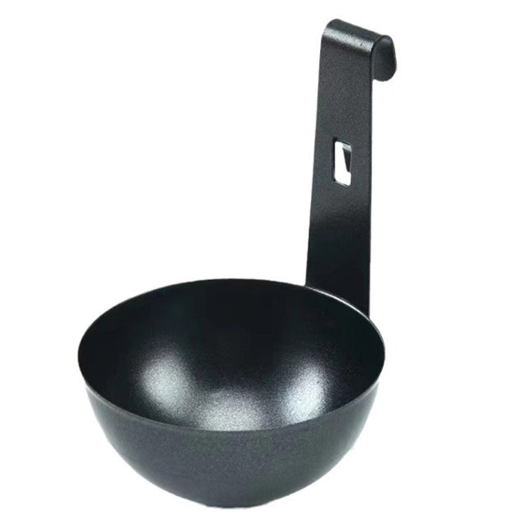 Black egg poaching cup with upright hanging handle, empty mould.
