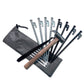 Gray ground spike storage bags with drawstrings and assorted metal stakes