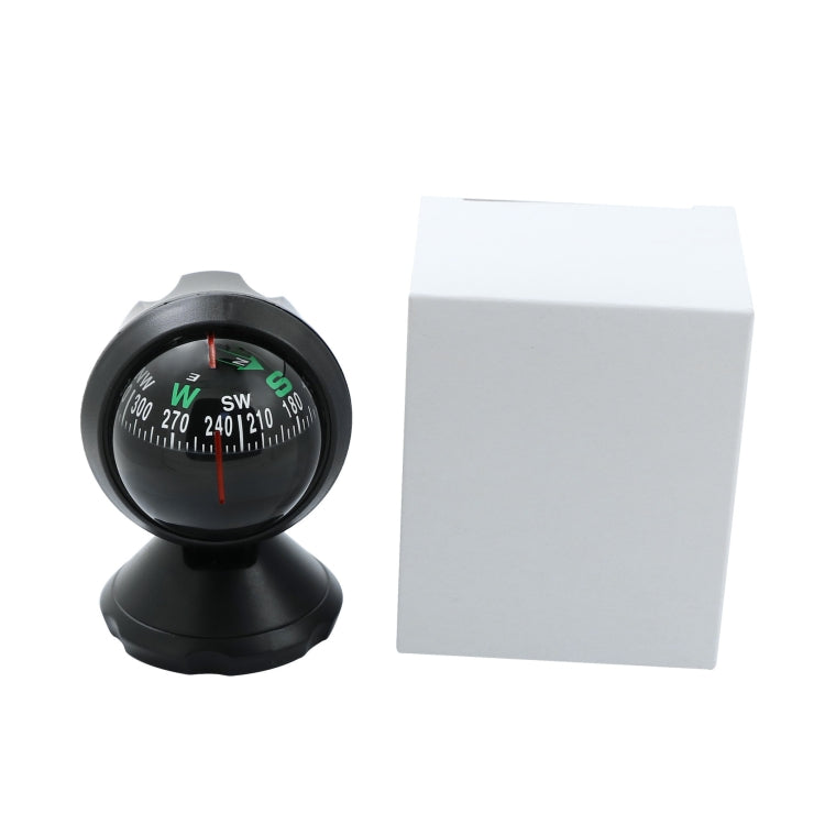 Black compass guide ball car ornament with spherical dial beside white box