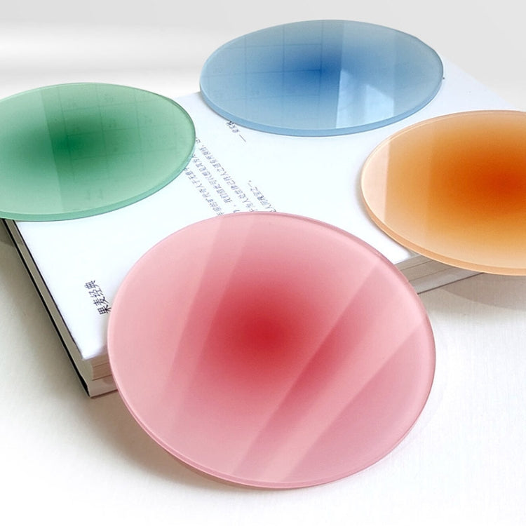 Assorted round translucent gradient coaster pads in blue, green, orange, and pink.