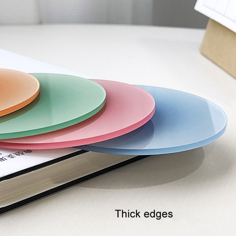 Stacked round translucent gradient coaster pads with thick edges in blue, pink, green.