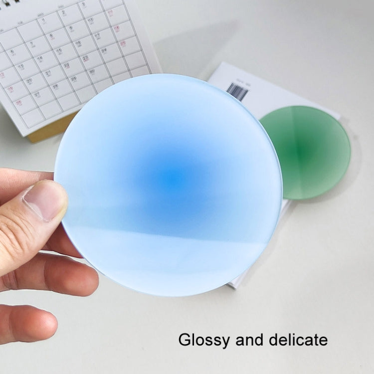 Blue translucent gradient acrylic coaster pad held in hand.