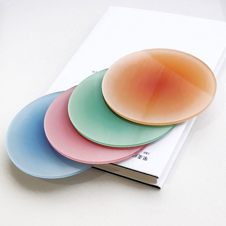 Overlapped round translucent gradient coaster pads in blue, green, and orange.