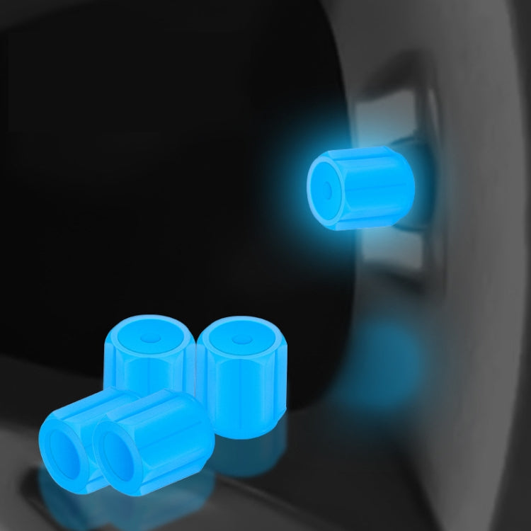 Blue luminous car tire valve caps set, glowing at the wheel valve stem