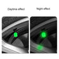Green luminous tire valve cap glowing on a car tire valve stem