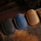 Set of three leather motorcycle smart remote key cases: black, blue, and brown
