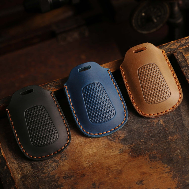 Set of three leather motorcycle smart remote key cases: black, blue, and brown