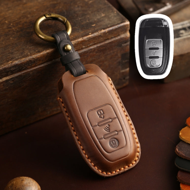 Brown leather key fob holder with brass ring and stitched edge