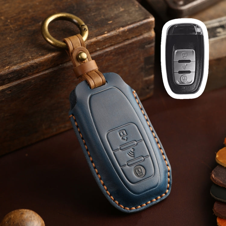 Blue leather key fob holder with brass snap loop and embossed remote buttons