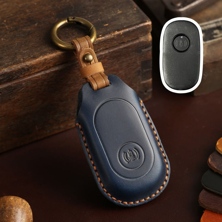 Blue leather remote key protective case with key ring loop and button icon panel.