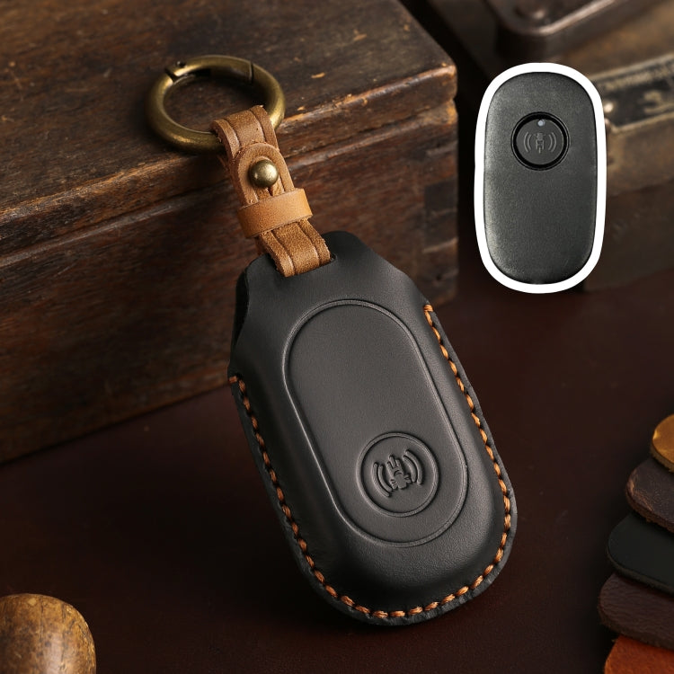 Black leather remote key protective case with key ring loop and button icon panel.