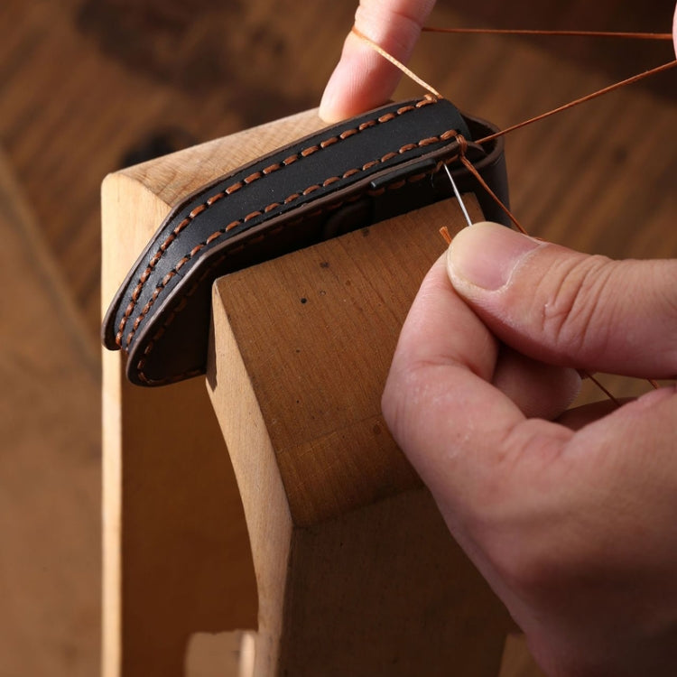 Leather remote key protective case with double-row edge stitching and cutout opening.
