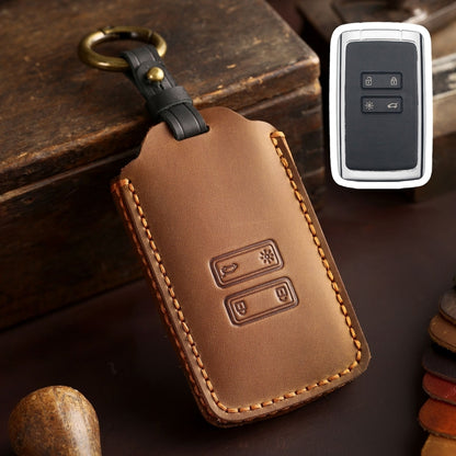 Brown leather car key case with stitched edges and key ring clip, remote view