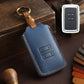 Blue leather car key case with stitched edges, key ring loop, remote view