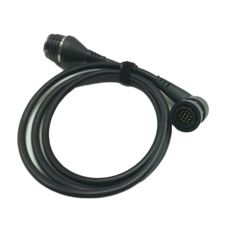 Black diagnostic cable adapter with circular multi-pin plug and textured connector tip