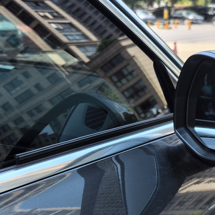 Car side window with installed black rubber wiper strip along the edge
