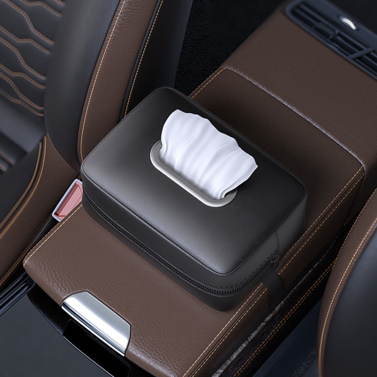 Black car seat armrest tissue box holder with handle strap, tissues visible