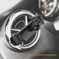 Black car air vent phone mount attached to round vent, close-up