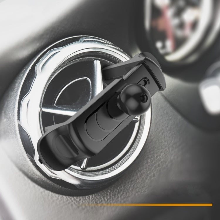 Black car air vent phone mount attached to round vent, close-up