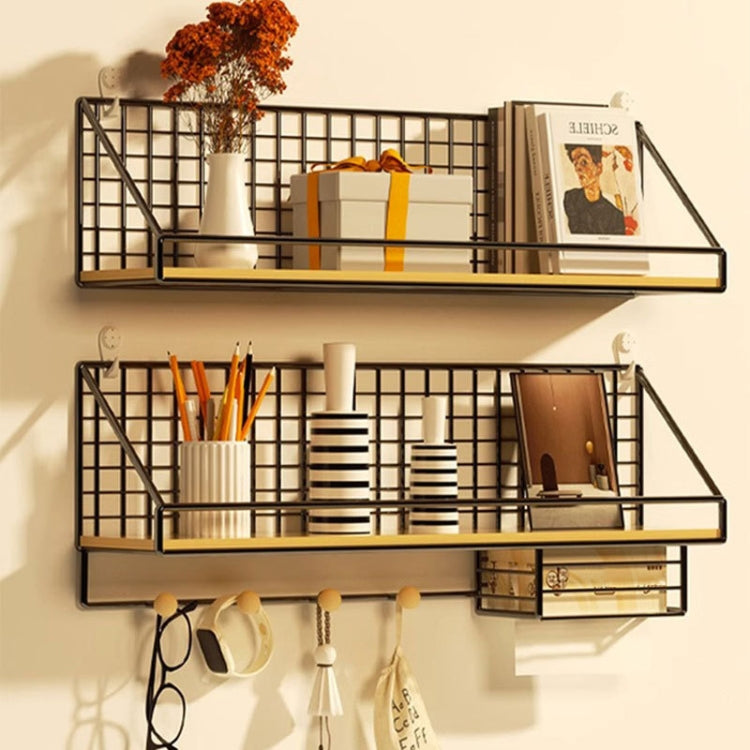 Black wall organizer shelf set with two metal grid tiers, hooks, and wood base