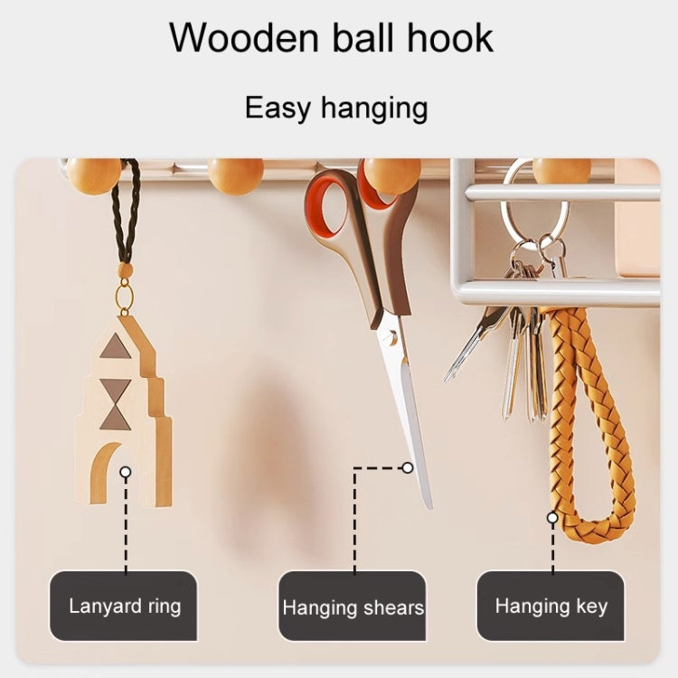 Black wall shelf with wooden ball hooks for keys, scissors, and lanyard