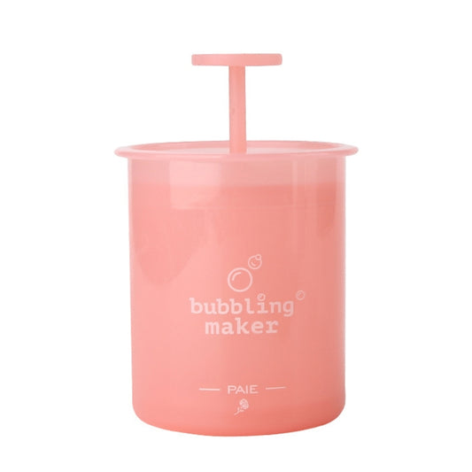 Pink foaming maker cup with manual pump top, translucent container