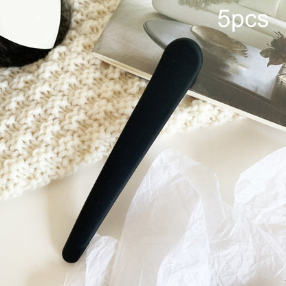 Black duckbill bangs clip for straight side hair, single piece.