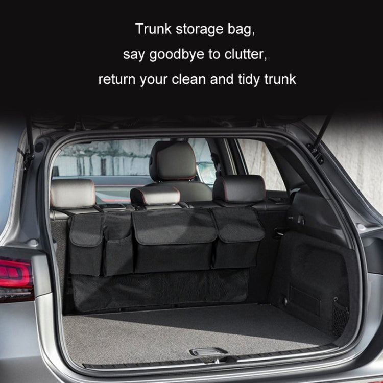 Trunk storage organizer bag installed in car cargo area, black fabric with pockets