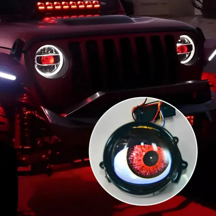 3-inch LED demon eye light with red iris glow and connected wire harness on the lens